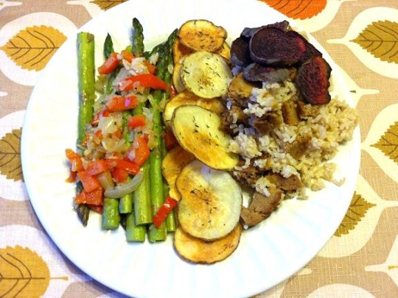 Asparagus with peppers, onions, and garlic. Baked potato slices with thyme and salt. Brown rice with field roast holiday roast and some beets. 
