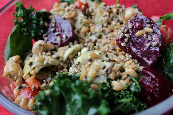 Lunch is always in a bowl. Spinach, kale, farro, wheat berries, beets, red pepper, and hemp seeds. 