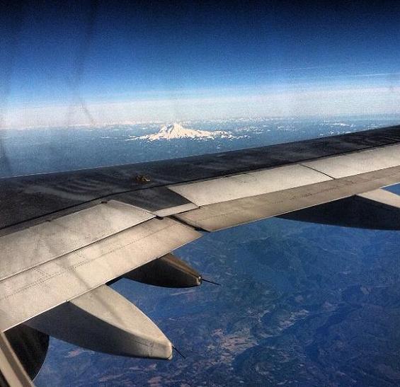 Green, snow-capped land.